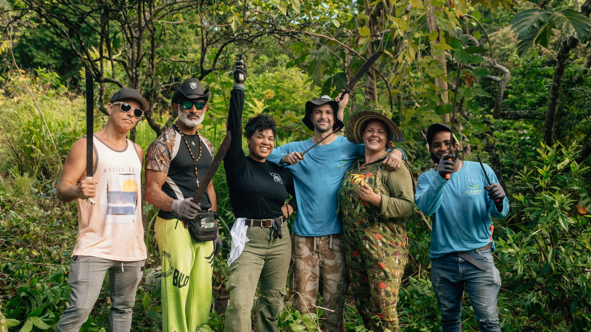Group of regenerative garden workers standing together in lush greenery